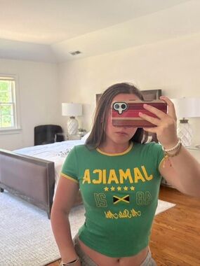 Bershka green Jamaica crop top with yellow text and flag graphic